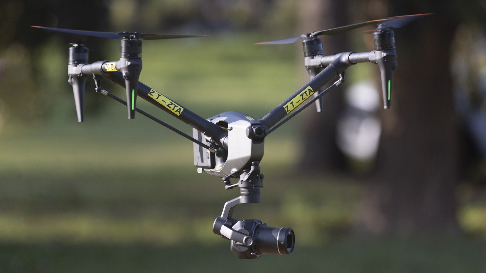 DJI Inspire series cinema drone in flight, gimbal camera below