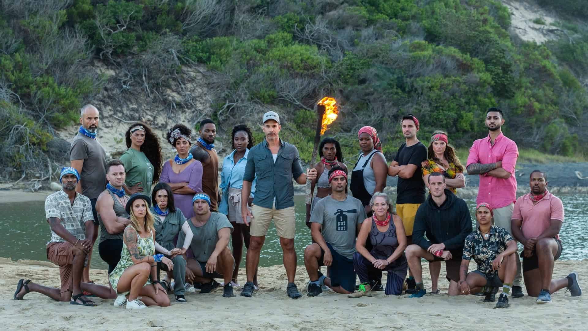 The cast of Survivor South Africa Return of the Outcasts together on a beach